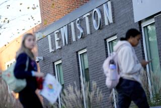 High School students return to school for the first time since the shootings that claimed 18 lives in their community, Tuesday, Oct. 31, 2023, in Lewiston, Maine. (AP Photo/Matt York)