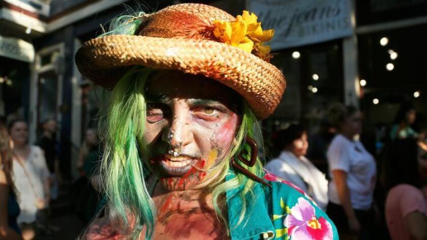 .Tammy Lee Farris of Oceanside poses for a photo after participating in the Zombie Walk at San Diego Comic-Con 2016. The Zombie Walk returned to the SDCC two years after a woman was hit and seriously injured by a driver who drove into the crowd. This is the walk's 10th year. #sdcc2016 . (Misael Virgen / San Diego Union-Tribune)
