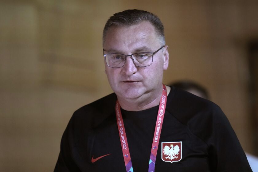 Poland's head coach Czeslaw Michniewicz arrives for a press conference in Doha, Qatar, Saturday, Dec. 3, 2022, on the eve of the World Cup soccer match between France and Poland. (AP Photo/Christophe Ena)