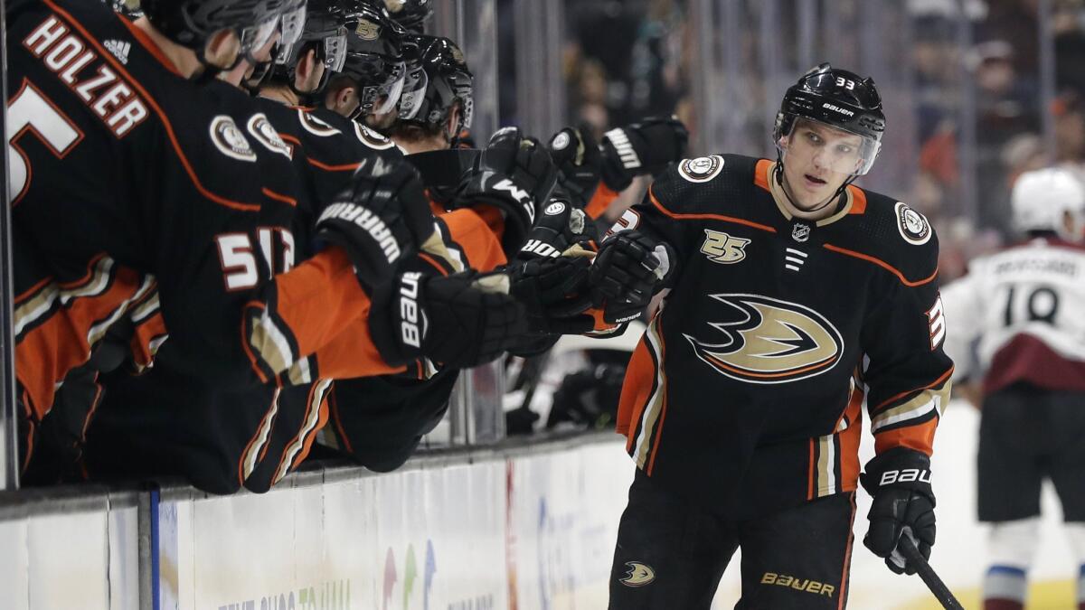 Ducks forward Jakob Silfverberg celebrates with teammates after scoring during the first period of a 2-1 victory over the Colorado Avalanche on Sunday.