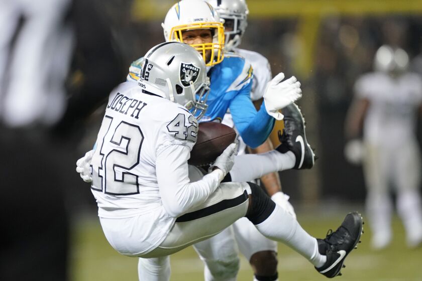 Raiders safety Karl Joseph intercepts a pass from Chargers quarterback Philip Rivers late in the fourth quarter of a game Nov. 7 at RingCentral Coliseum. 