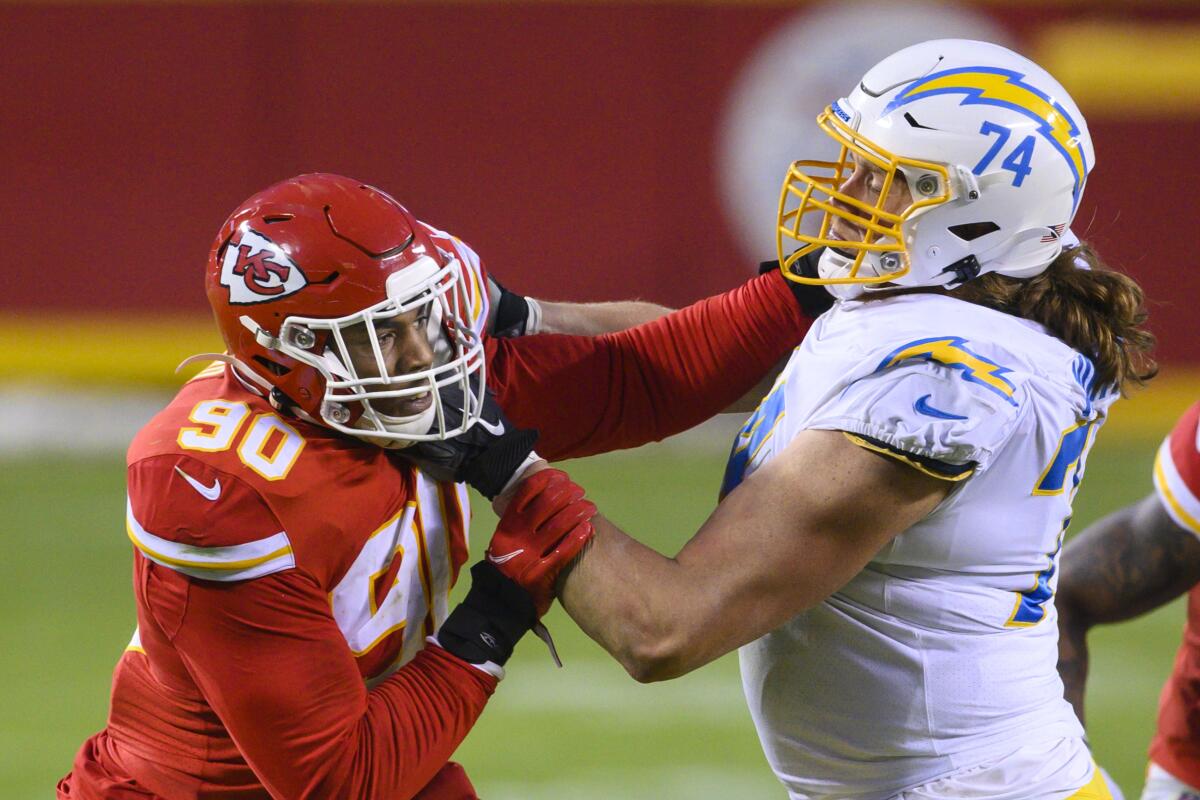 Kansas City Chiefs defensive end Tim Ward (90) battles  Chargers offensive tackle Storm Norton in January.