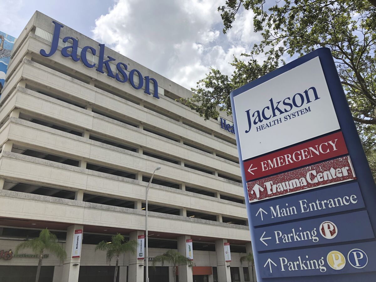 An entrance at Jackson Memorial Hospital is shown, Thursday, July 9, 2020, in Miami. Florida reported on Thursday the biggest 24-hour jump in hospitalizations, with more than 400 patients being admitted. (AP Photo/Wilfredo Lee)