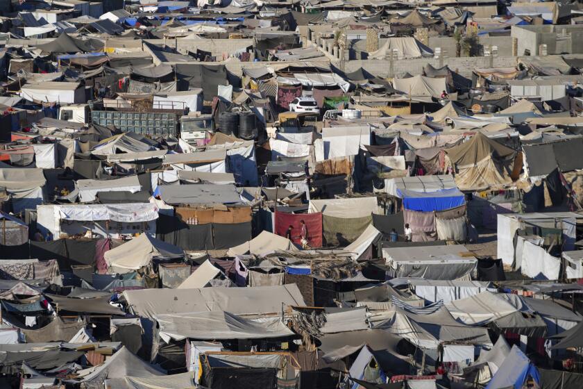 Tents are crammed together as displaced Palestinians camp on the beach, west of Deir al-Balah, Gaza Strip, Tuesday, Aug. 20, 2024. (AP Photo/Abdel Kareem Hana)