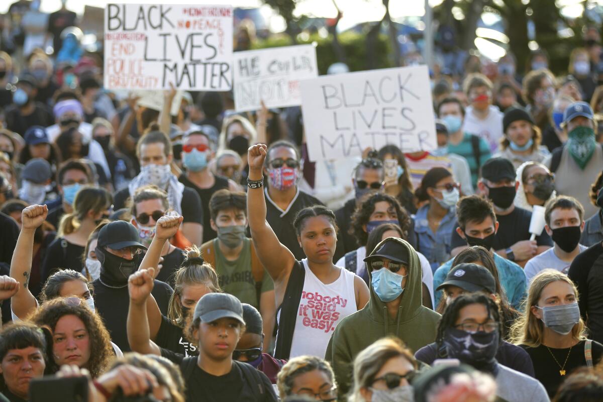 People gather to protest the death of George Floyd at the San Diego County Administration building on May 31.