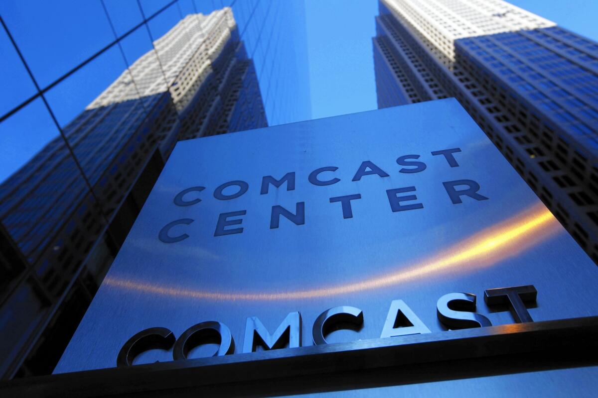 Comcast maintains the regulatory review of its Time Warner Cable acquisition is proceeding on schedule. Above, Comcast offices in Philadelphia in 2009.