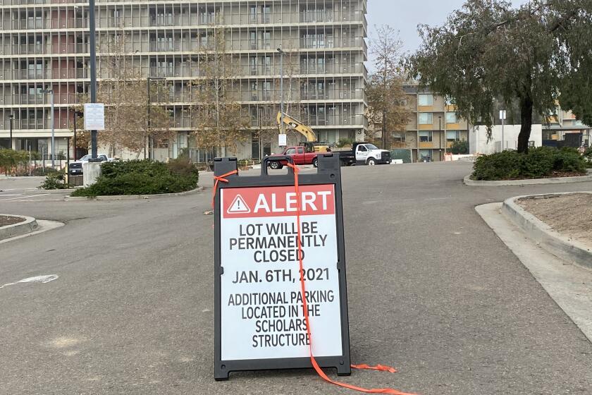 Parking lot P103 at UC San Diego, along with P102 across the street, is permanently closed as construction begins on TDLLN