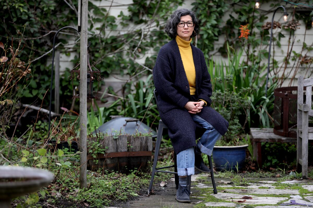 Miya Yoshitani, executive director of the Oakland-based Asian Pacific Environmental Network, in the garden of her home.