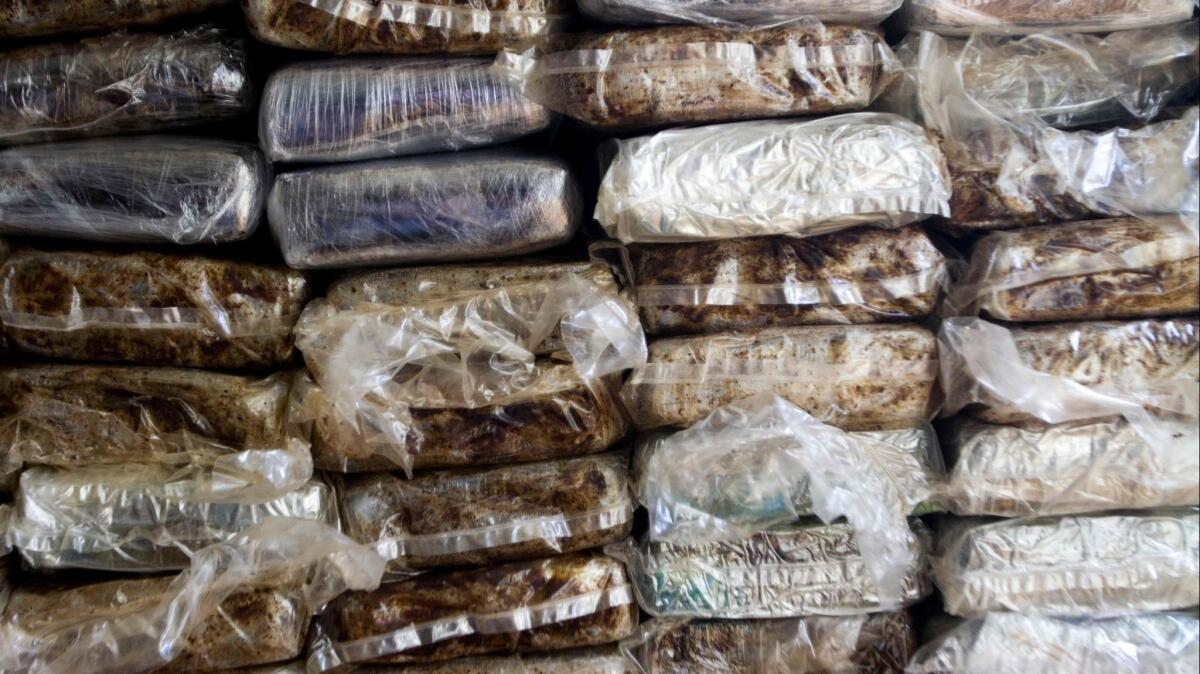Seized cocaine is shown in a 2013 photo. A U.S. Marine veteran was named in a massive cocaine trafficking indictment in San Diego this week.
