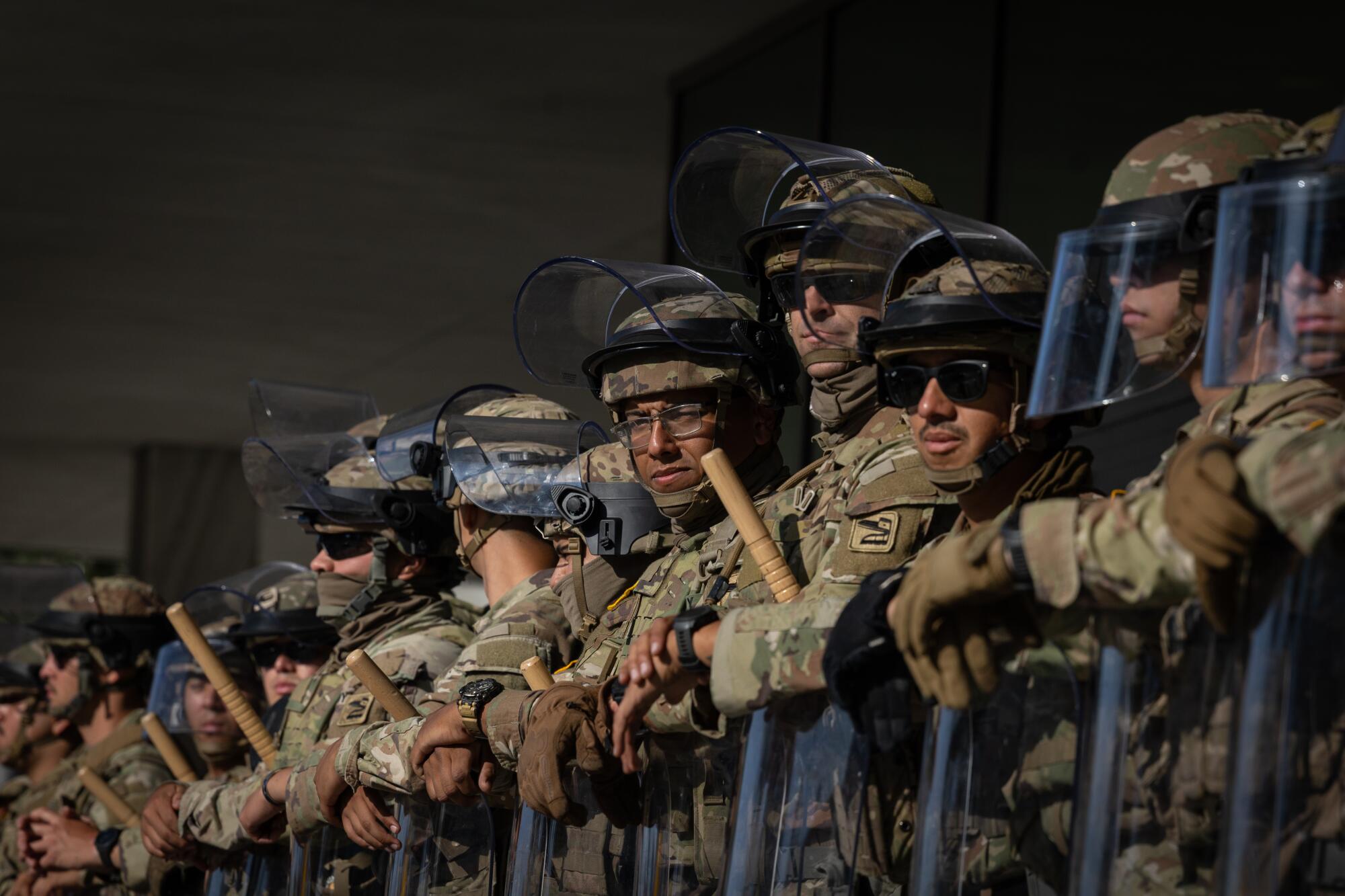 Federal officers and the National Guard protect the Federal Building in downtown Los Angeles.