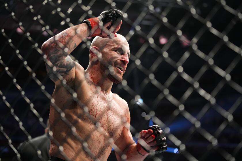 FILE - Alexander Volkanovski reacts after winning a featherweight title bout against Max Holloway during the UFC 276 mixed martial arts event, July 2, 2022, in Las Vegas. Volkanovski will face interim champ Yair Rodriguez in UFC 290 in Las Vegas on Saturday, July 8, 2023. (AP Photo/John Locher, File)
