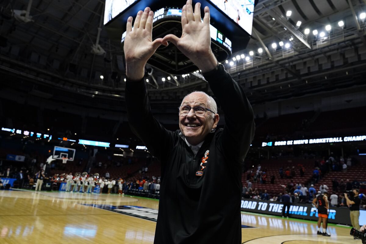 Miami head coach Jim Larranaga cheers with fans after a win over Auburn.