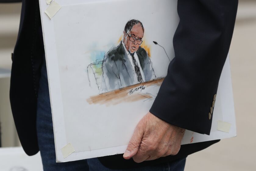 Los Angeles, CA - March 30: A courtroom artist holds a rendering of suspended Los Angeles County Supervisor Mark Ridley-Thomas, whio was found guilty of corruption on Thursday, Mar. 30, 2023. The guilty verdicts stem from Ridley-Thomas' dealings with the University of Southern California School of Social Work. (Luis Sinco / Los Angeles Times)