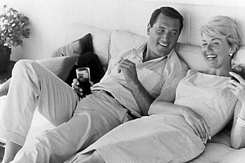 (FILES) This undated file photo shows US actress Doris Day (R) relaxing with US actor Rock Hudson (L). Day and Hudson starred in several romance/comedy Hollywood films in the 1960's. - Doris Day, the US screen icon famed for her wholesome, girl-next-door appeal in a string of box office hits, died Monday, May 13, 2019 at age 97 her foundation said in a statement to US media. The Doris Day Animal Foundation said Day, who had suffered a bout of pneumonia, died at her California home, surrounded by friends and family, multiple news outlets reported. (Photo by HO / HO / AFP)HO/AFP/Getty Images ** OUTS - ELSENT, FPG, CM - OUTS * NM, PH, VA if sourced by CT, LA or MoD **