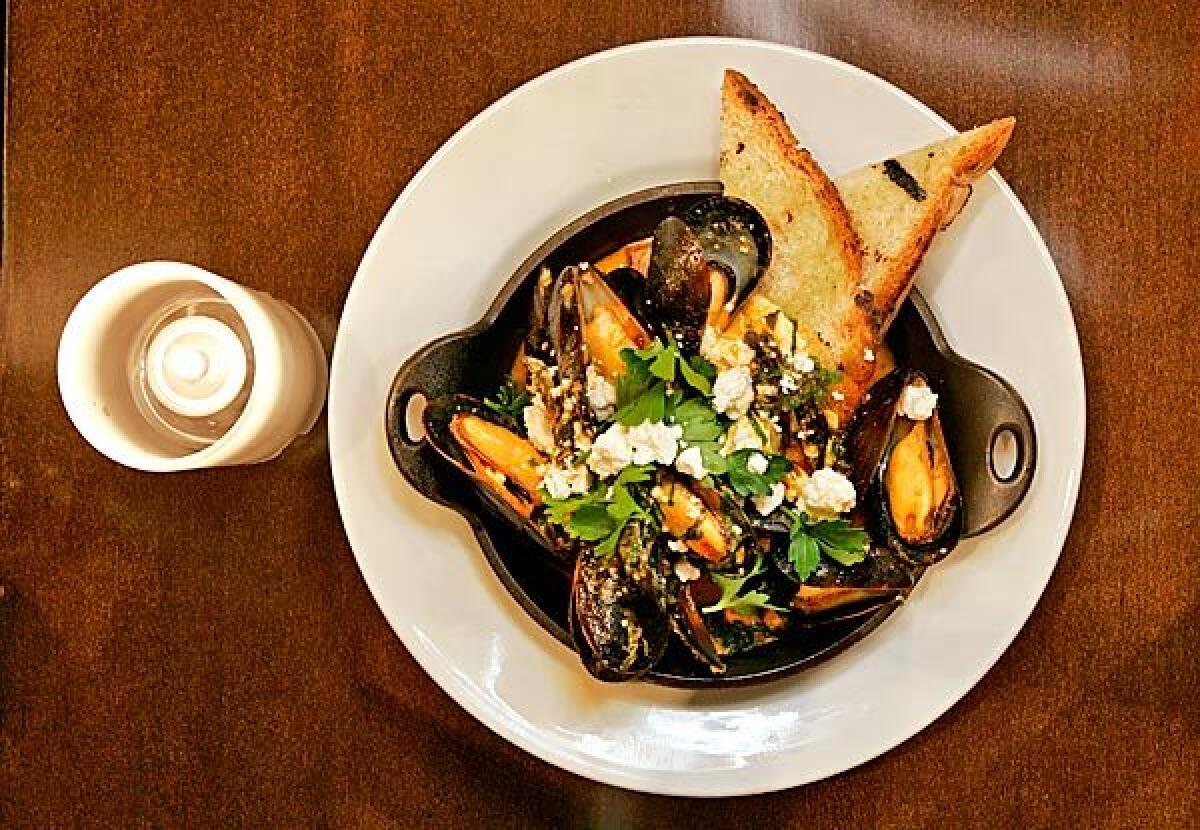 Brick-roasted mussels are served at Lazy Ox Canteen in downtown Los Angeles.