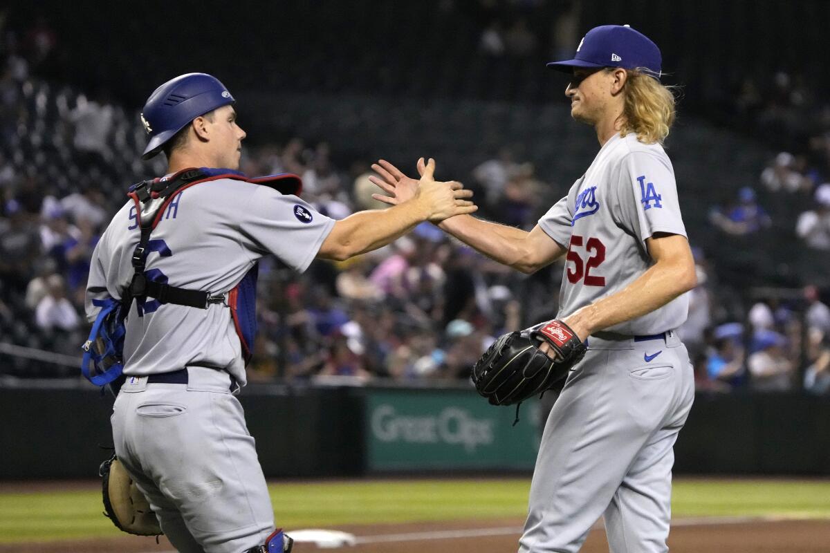 Dodgers catcher Will Smith and reliever Phil Bickford celebrate.