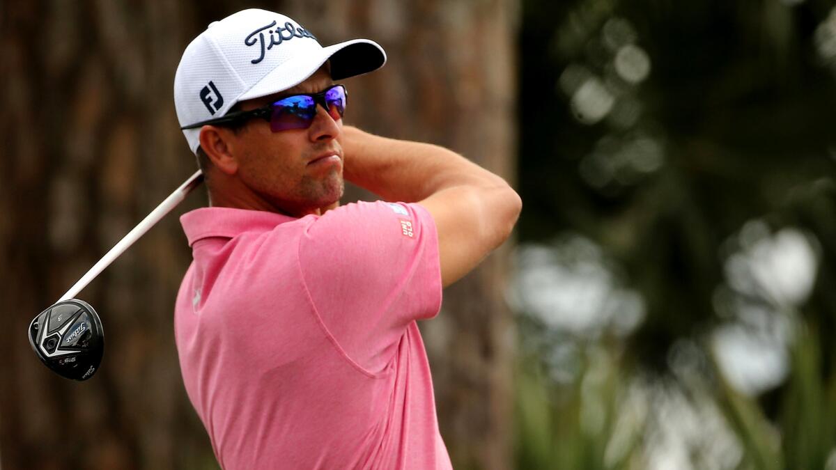 Adam Scott follows through on his tee shot at No. 2 during the final round of the Honda Classic on Sunday.