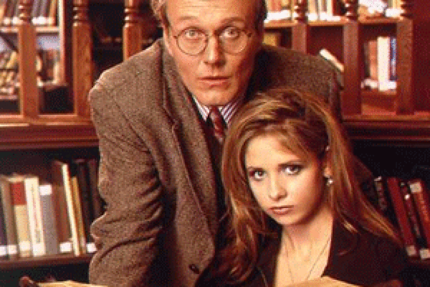 Buffy and Giles study dark matters. (Photo credit: Richard Cartwright/WB)