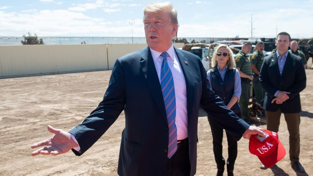 President Trump speaks to Border Patrol agents during his visit to a portion of the U.S.-Mexico border wall in Calexico, Calif., on April 5.