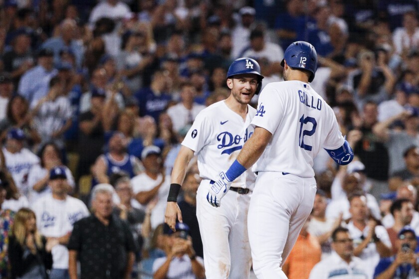 Joey Gallo, right, celebrates with Dodgers teammate Trea Turner after hitting a three-run home run.