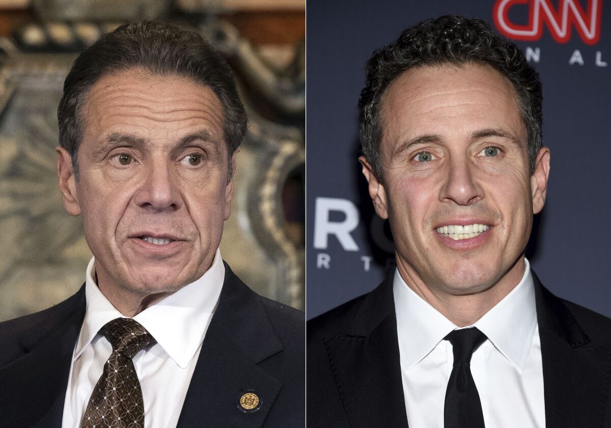 FILE - New York Gov. Andrew M. Cuomo appears during a news conference about the COVID-19at the State Capitol in Albany, N.Y., on Dec. 3, 2020, left, and CNN anchor Chris Cuomo attends the 12th annual CNN Heroes: An All-Star Tribute at the American Museum of Natural History in New York on Dec. 9, 2018. Chris Cuomo has told viewers that he “tried to do the right thing” when balancing his role as a journalist and brother to outgoing New York Gov. Andrew Cuomo, who announced his resignation following allegations of sexual harassment. Chris Cuomo returned to the air Monday, Aug. 16, 2021, for the first time following his brother's announcement and addressed what has become an awkward issue for his employer. (Mike Groll/Office of Governor of Andrew M. Cuomo via AP, left, and Evan Agostini/Invision/AP)