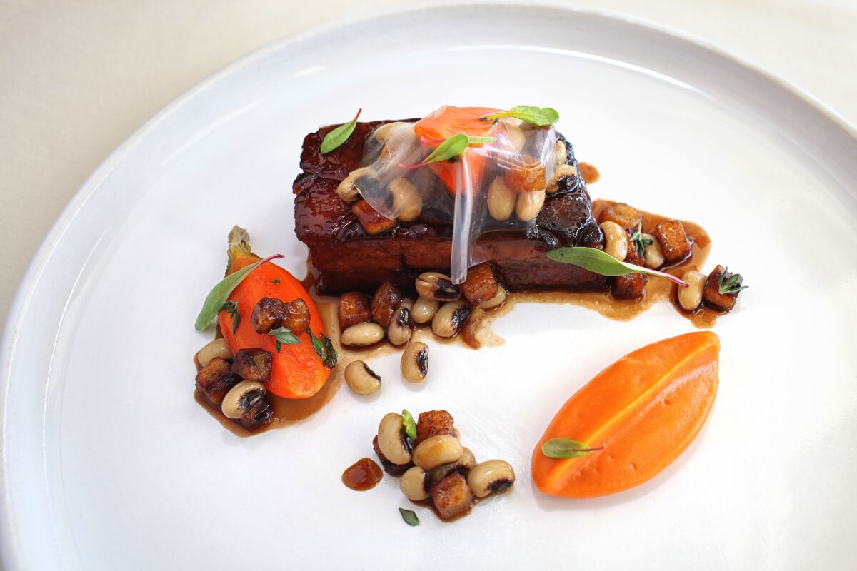 Jamaican Jerk Pork Belly is one of two recipes from La Jolla's Nine-Ten that are included in "United We Cook."