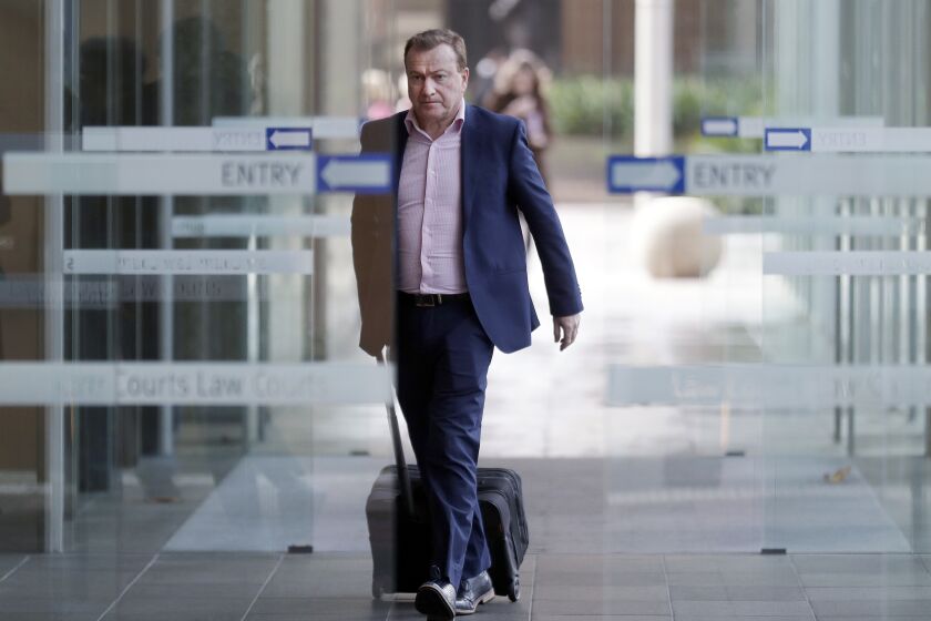  In this May 2021 photo, Andrew Cooper, president of libertarian group LibertyWorks, arrives at Federal Court in Sydney.