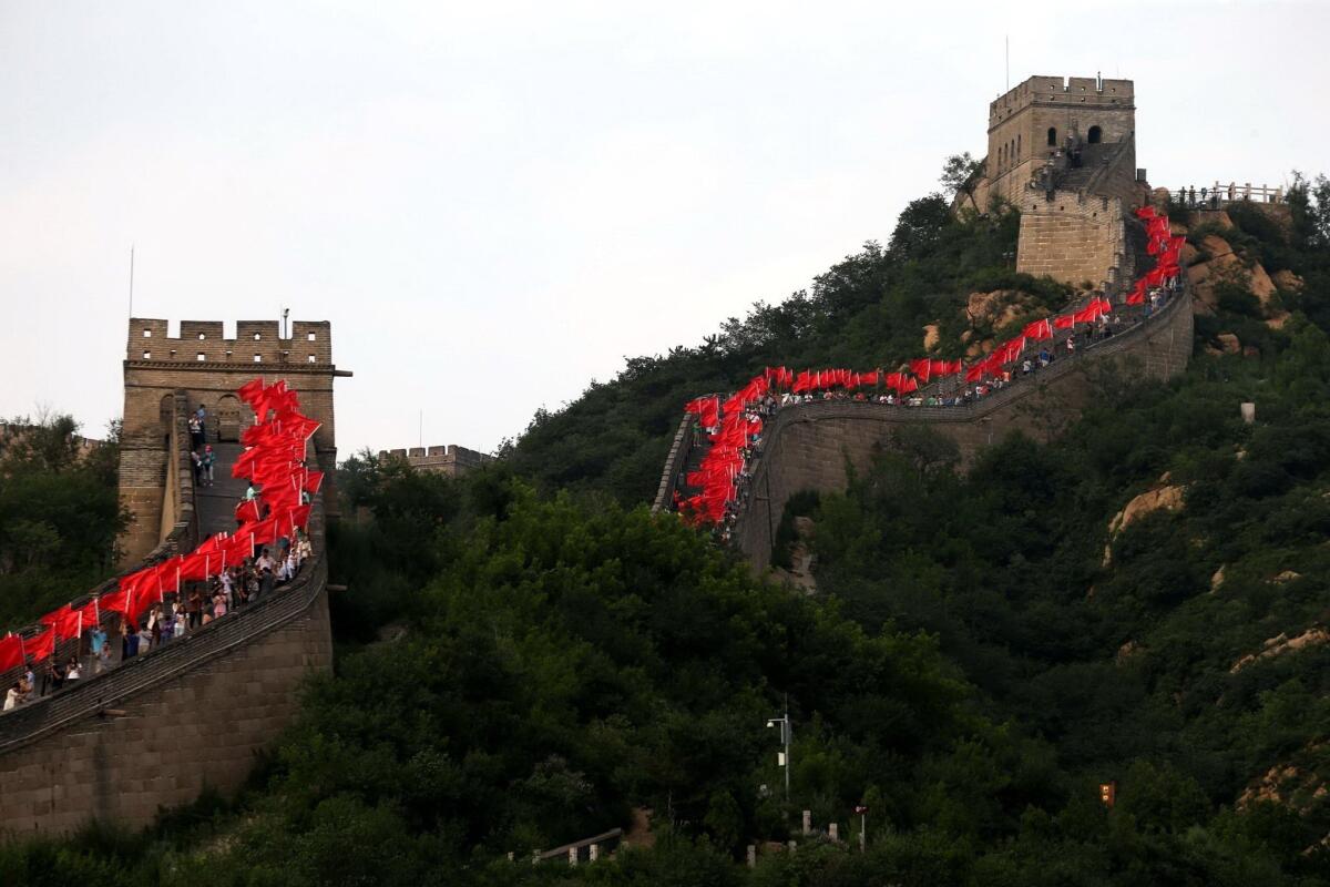 Chinese people gather to celebrate as Beijing is announced as the host city for the 2022 Winter Olympic Games, on the Great Wall in Beijing on July 31, 2015.CHINA OUT AFP PHOTOSTR/AFP/Getty Images ** OUTS - ELSENT, FPG - OUTS * NM, PH, VA if sourced by CT, LA or MoD **