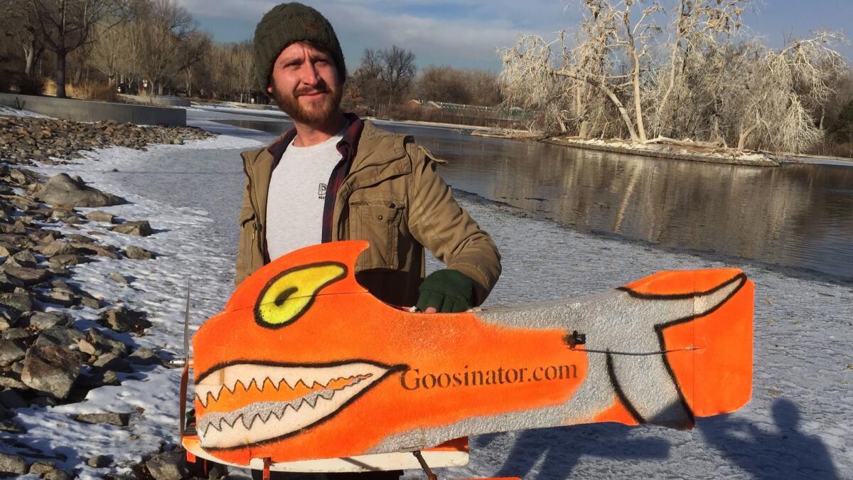 Scott Bartell, natural resources technician with Denver parks, used a "goosinator" to clear a pond in City Park of more than 600 geese in less than a few seconds.