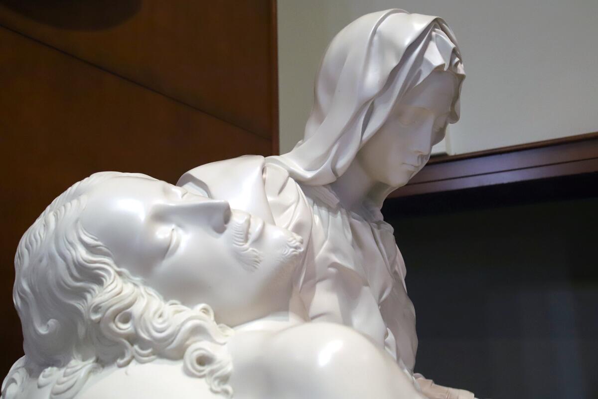 The sculpture of Michelangelo's Pietà depicts the body of Jesus cradled by his mother, Mary, after the crucifixion.