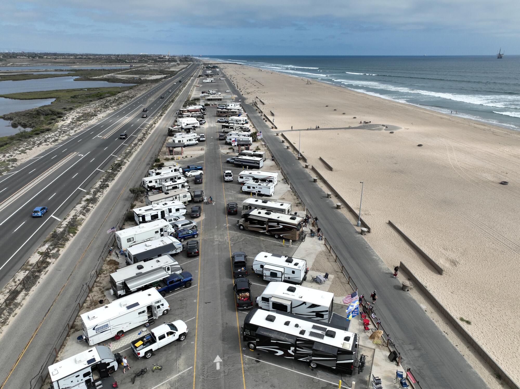 An aerial view of campers arriving and setting up during the Memorial Day weekend at Bolsa Chica State Beach campground