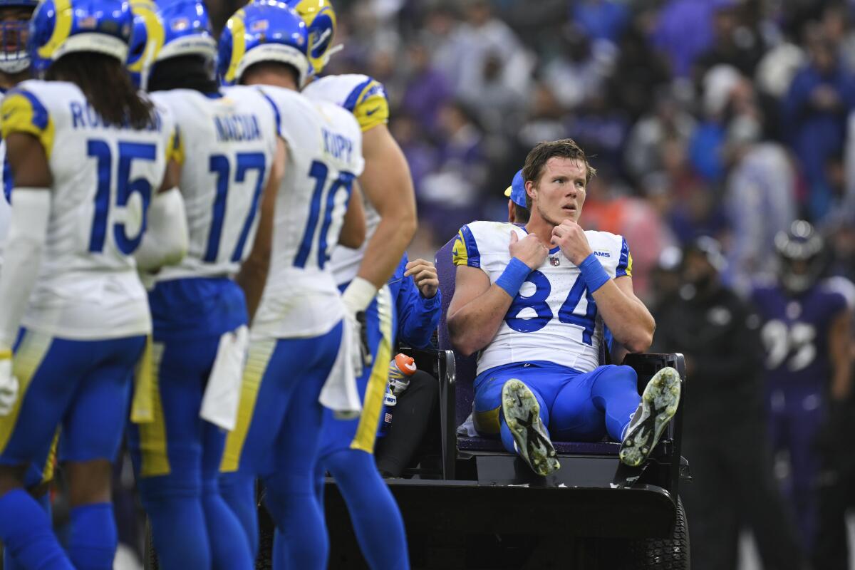 Rams tight end Hunter Long (84) removed from the field by cart after injuring his knee.