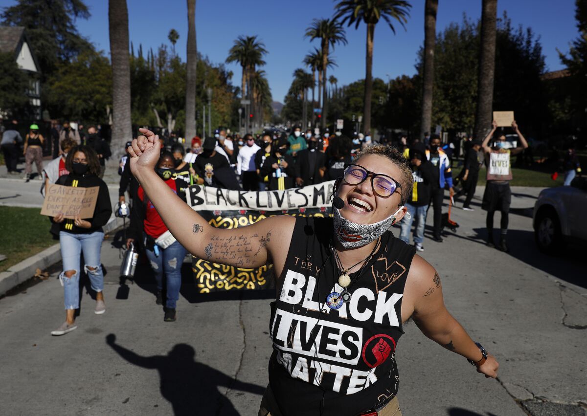 Black Lives Matter Los Angeles organizer Tekoah Flory protests outside the L.A. mayor's home on Nov. 30, 2020.