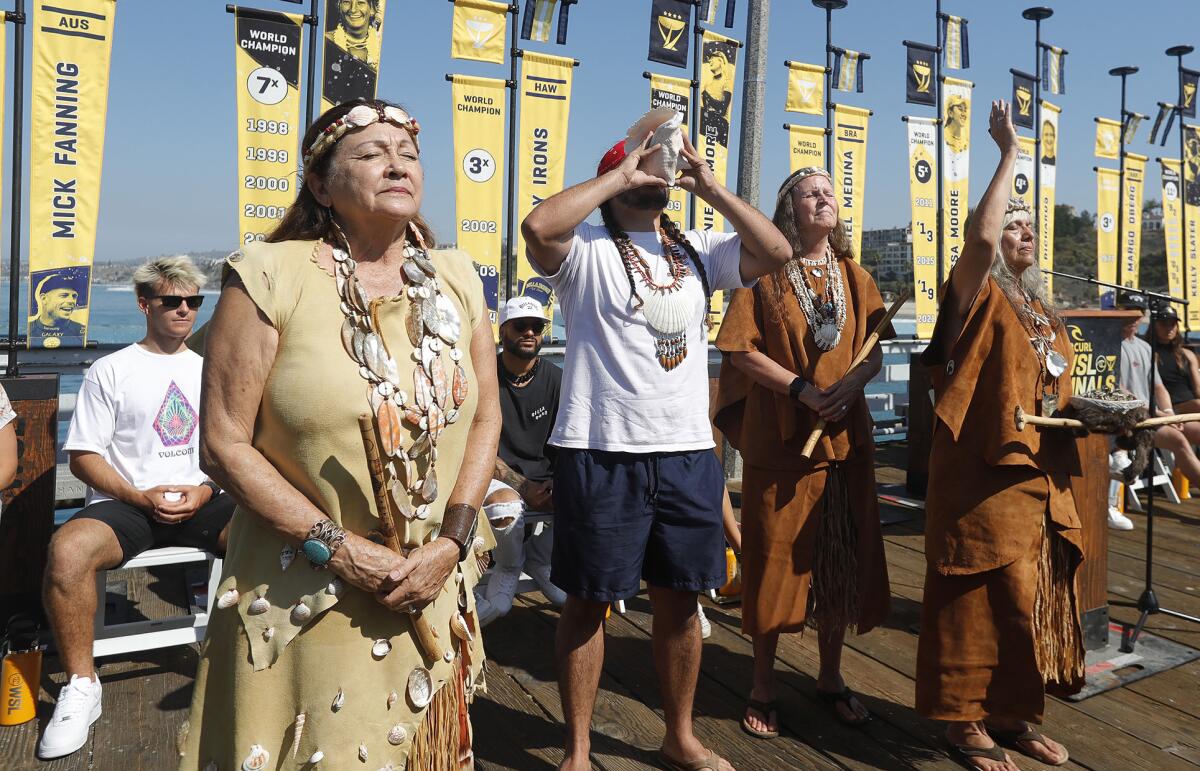 Officials from the local Juaneno Indian community bless the proceedings Tuesday for the World Surf League finals.