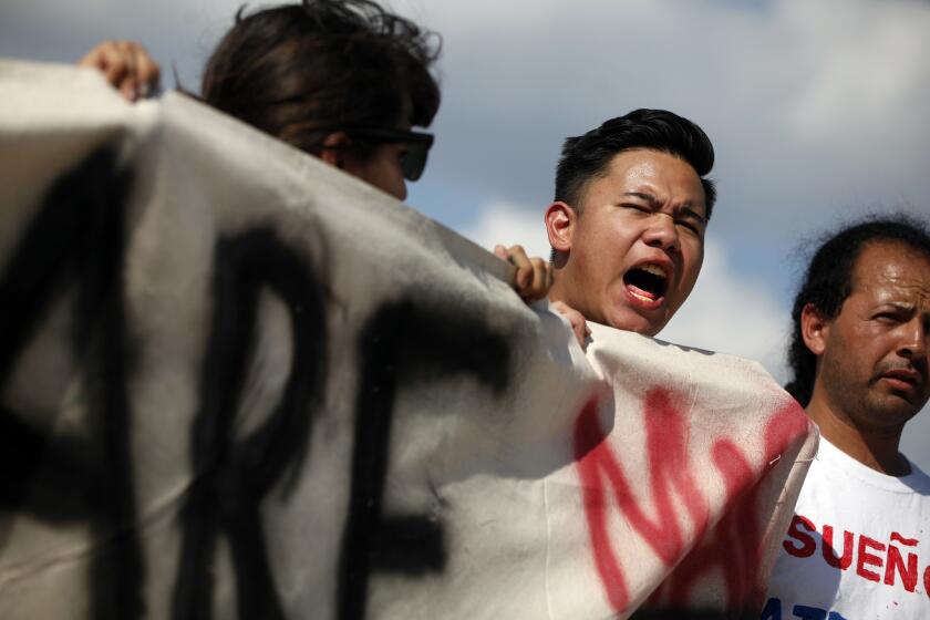 Ray Jose, 23, of Rockville, Md., leads a chant across the street from the Border Patrol station in McAllen, Texas, just after Pulitzer Prize-winning journalist Jose Antonio Vargas was released.