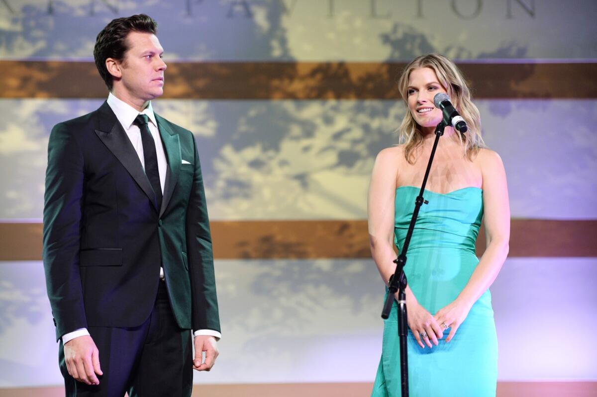 Honorees Hayes MacArthur and Ali Larter speak onstage at the Art of Elysium's seventh annual "Heaven" Gala, at which they received the Spirit of Elysium Award.