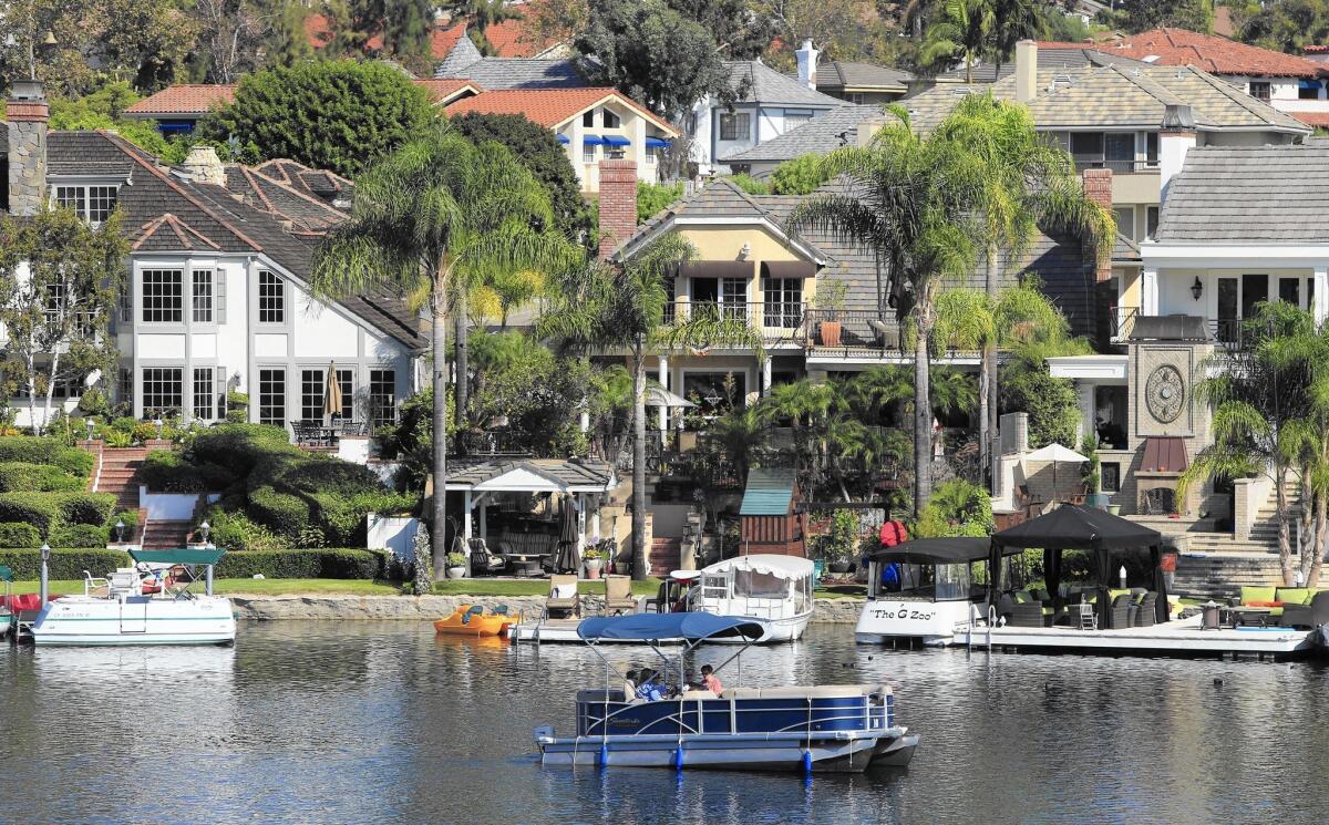 Homeowners’ equity holdings nationwide are up sharply and interest rates are near historical lows, leading to more home equity borrowing. Above, homes in Mission Viejo.