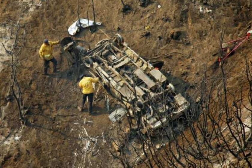 Investigators study the vehicle that plunged down a canyon, killing two L.A. County firefighters who had been supervising inmates trained in wilderness protection.