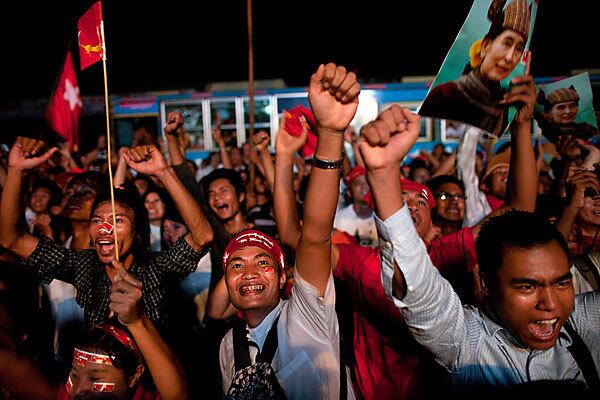 Supporters rejoice outside party headquarters in Yangon, Myanmar