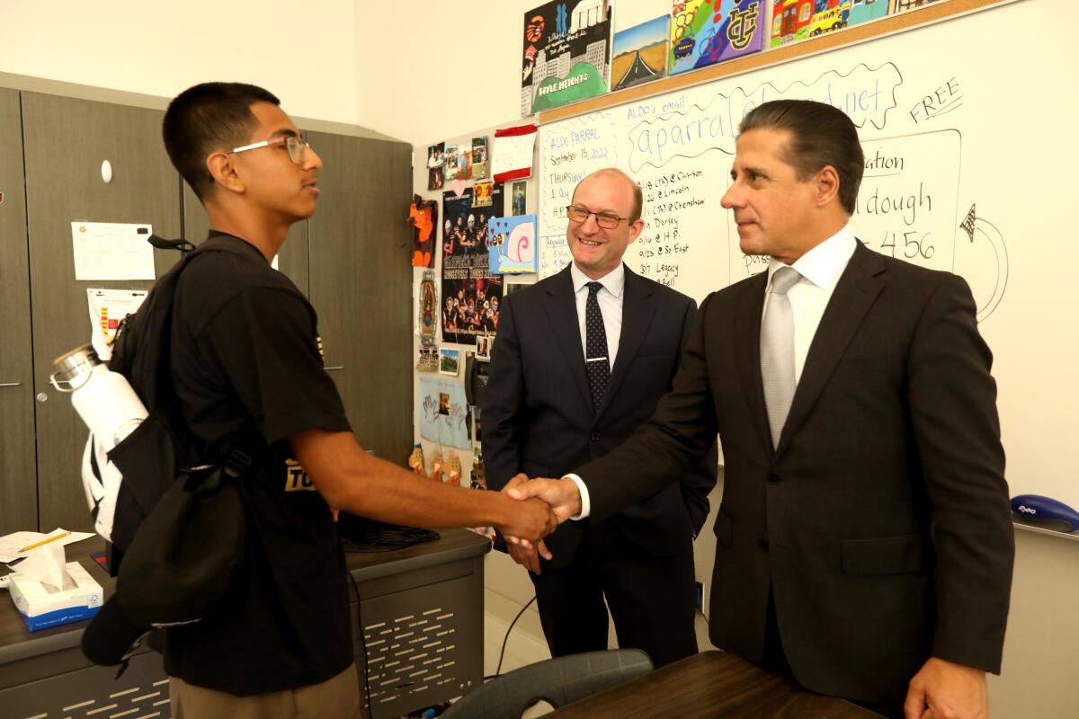 LAUSD Supt. Alberto Carvalho shakes a student's hand.