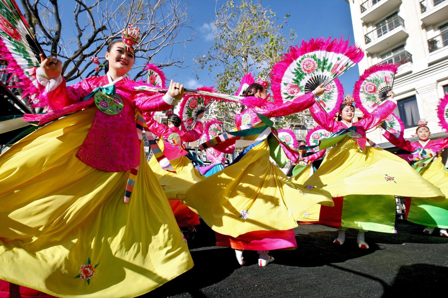 Members of the Kim Eung Hwa Dance Academy perform the Fan Dance during the annual Lunar New Year celebration at the Americana at Brand in Glendale on Saturday, Feb. 4, 2017. Crowds were treated to a parade, performances along with games at the outdoor venue.