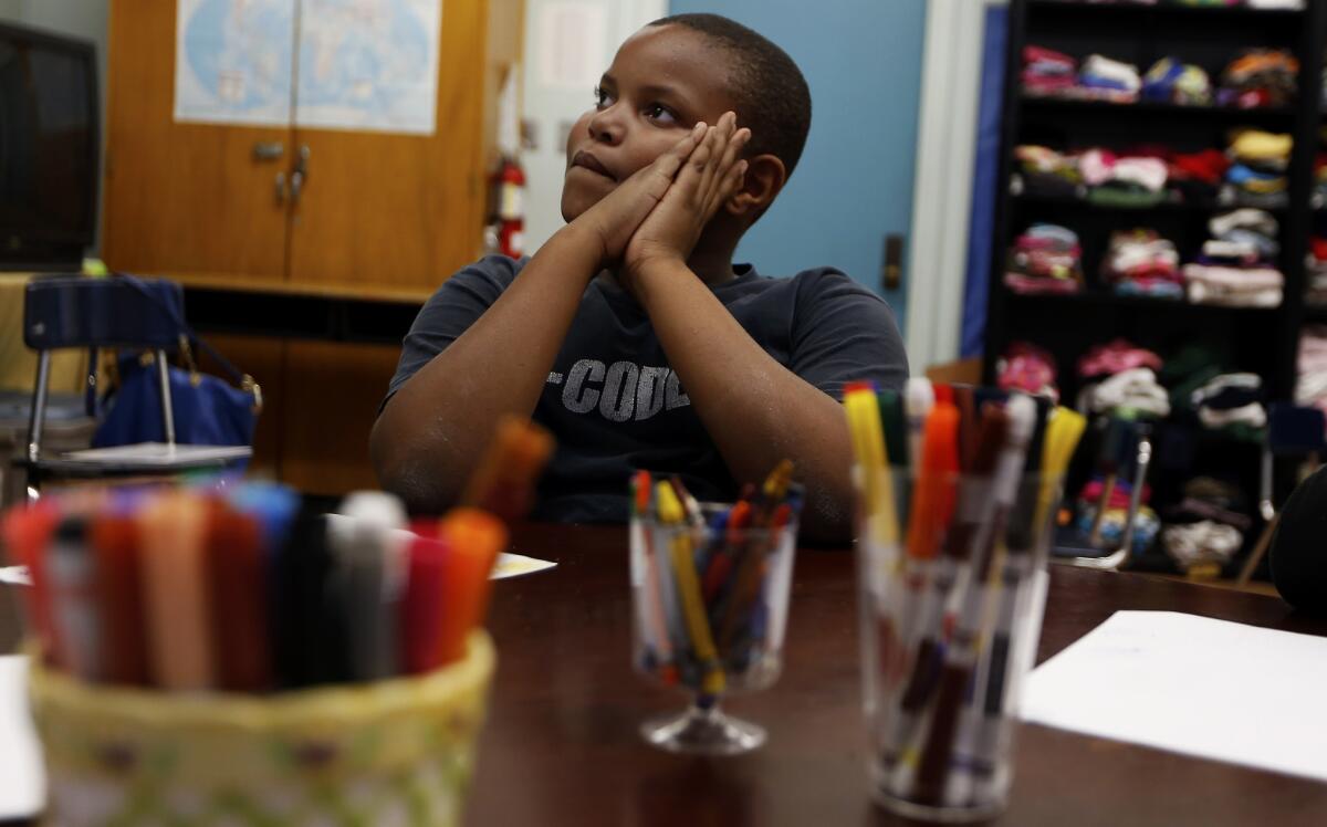 Christopher Bland, a student at West Athens Elementary School in South L.A., participates in an art-based counseling program called Share and Care.