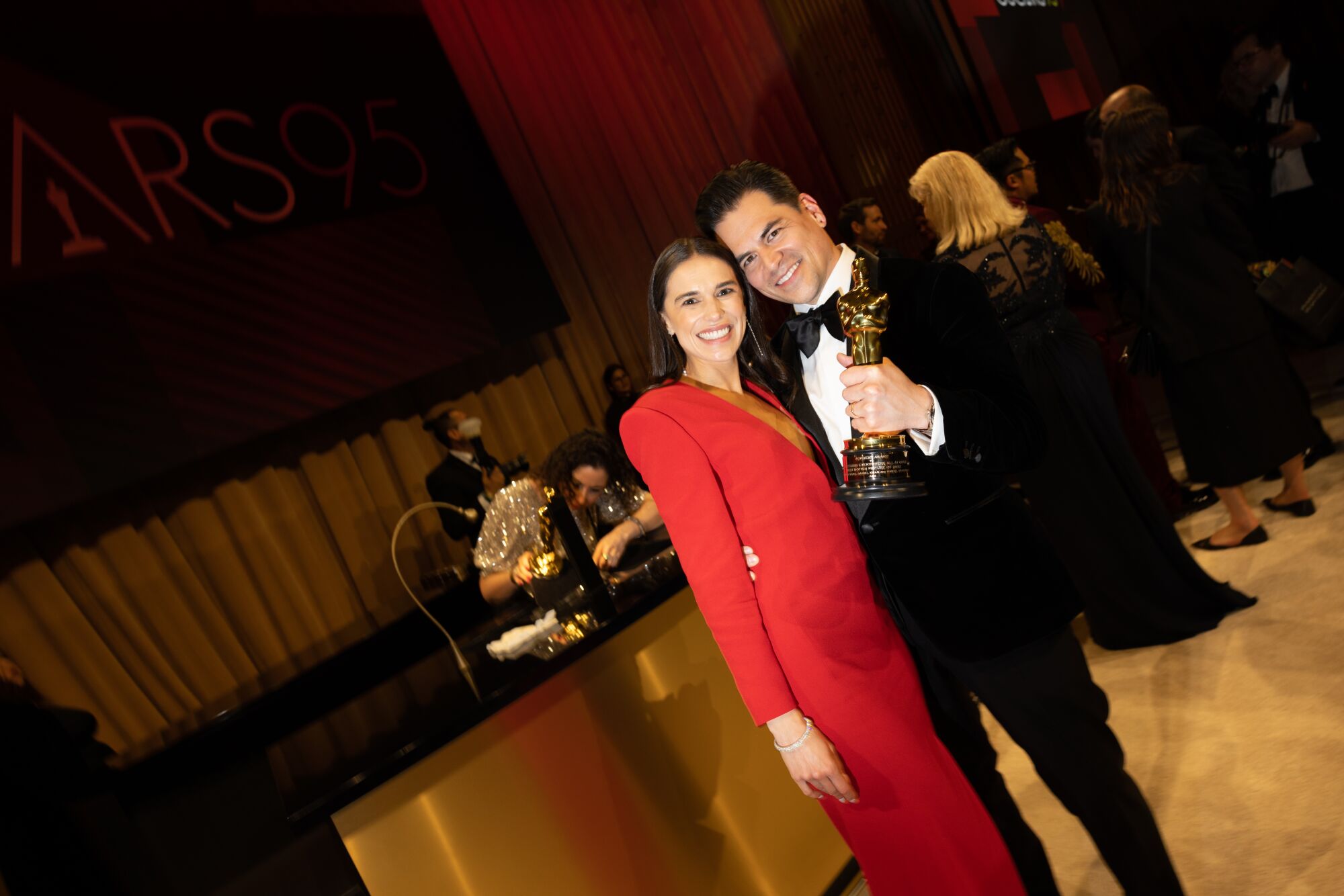 Jonathan Wang holds an Oscar statuette.