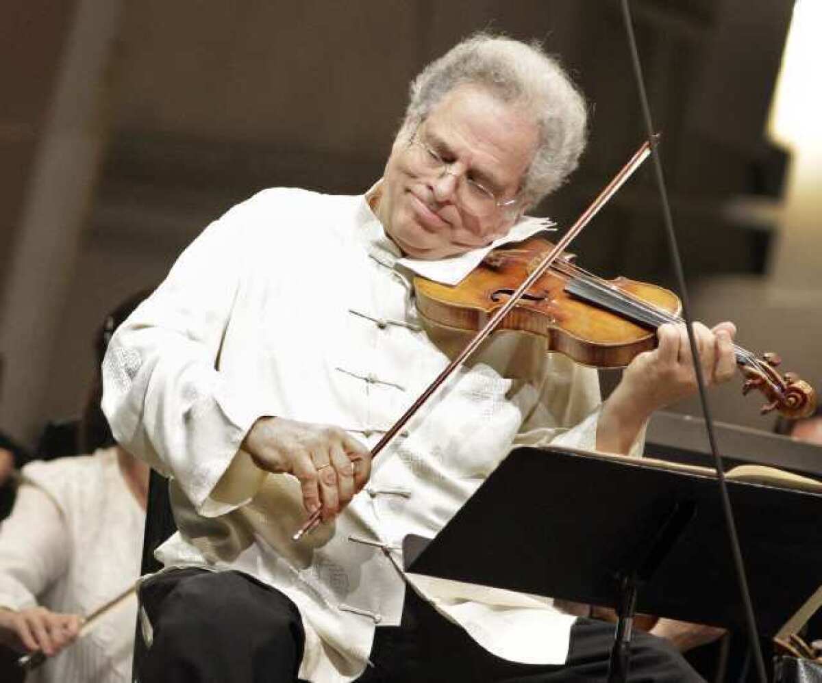 Violinist Itzhak Perlman performing with the Los Angeles Philharmonic earlier this month at the Hollywood Bowl.