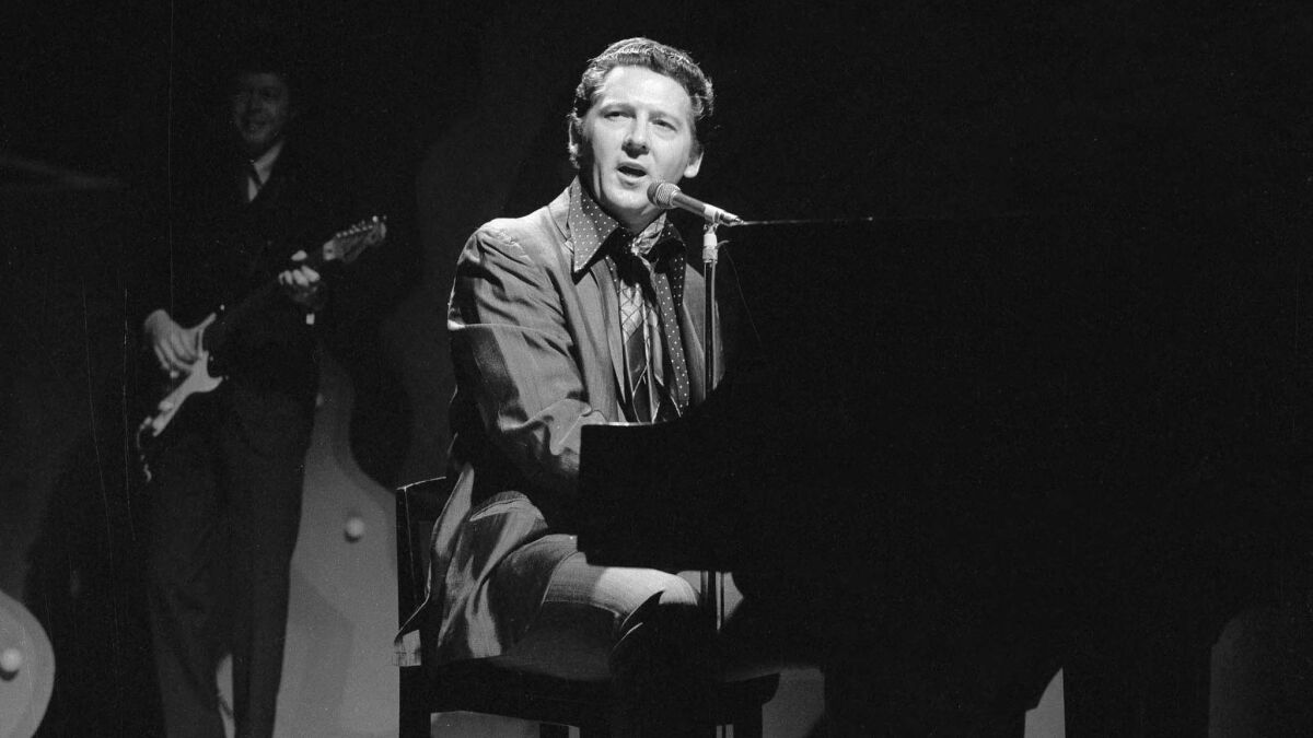 Jerry Lee Lewis plays the piano and sings as he appears on the CBS variety program "The Ed Sullivan Show."
