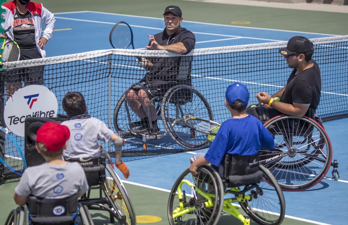 Paralympian David Wagner speaks with youth players April 24 at Orange County Great Park in Irvine.