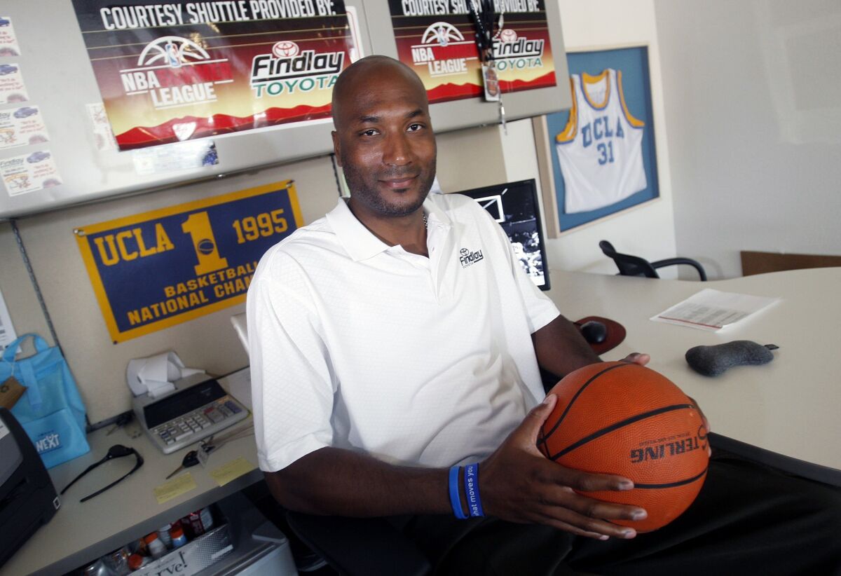 Former UCLA basketball player Ed O'Bannon Jr. sits in his office in Henderson, Nev., in 2010. O'Bannon spearheaded a lawsuit arguing that college athletes should get a portion of the billions in revenue that the NCAA generates through TV broadcasts and video games bearing the names, images and likenesses of players.