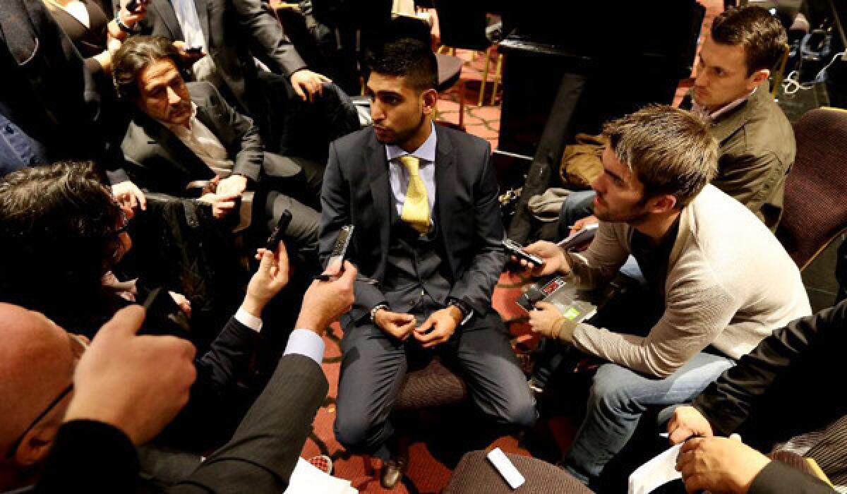 Amir Khan talks to the media during his news conference on Oct. 9 to announce his upcoming fight with Carlos Molina.