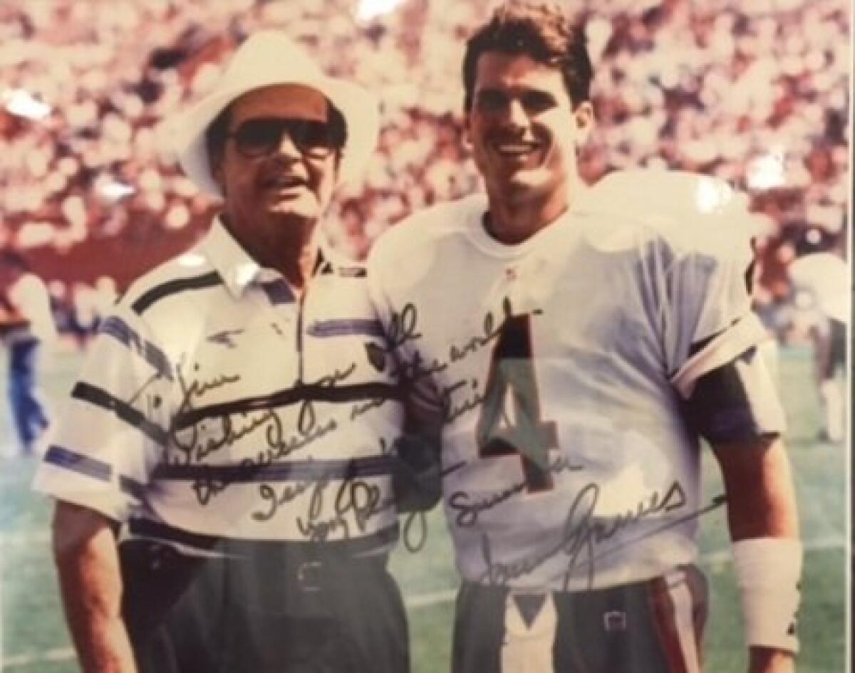 Actor James Garner (left) and former Chicago Bears quarterback Jim Harbaugh pose for a picture at the Los Angeles Coliseum.