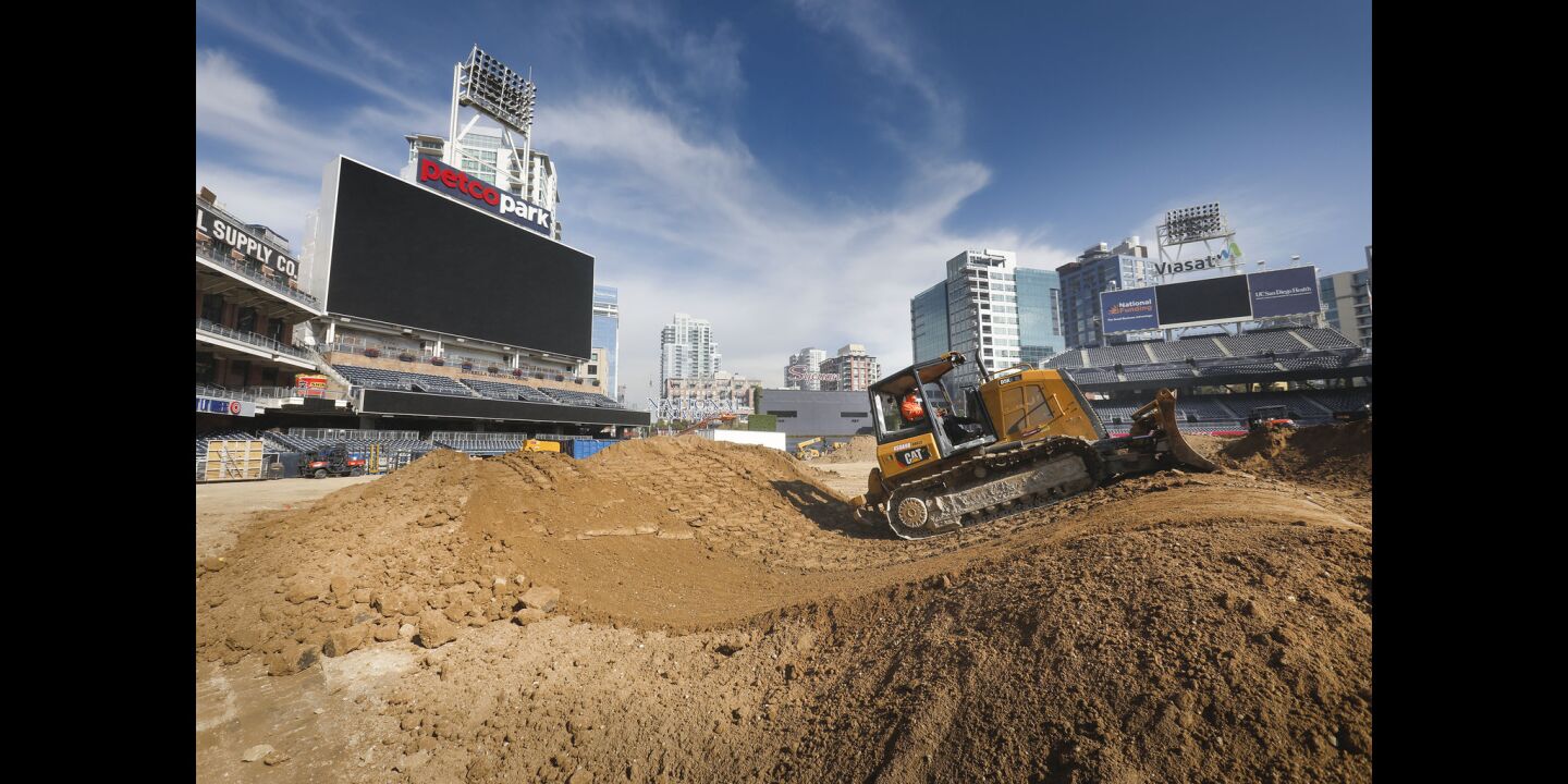 Billy Swapp operates a bulldozer to create jumps on the racetrack being created out of 26 million pounds of dirt on the baseball field at Petco Park, in preparation for the Monster Energy Supercross, to be held Saturday, February 2. Padres fans need not worry about the field. After the supercross is over, a new field will be installed, and ready for the 2019 season.